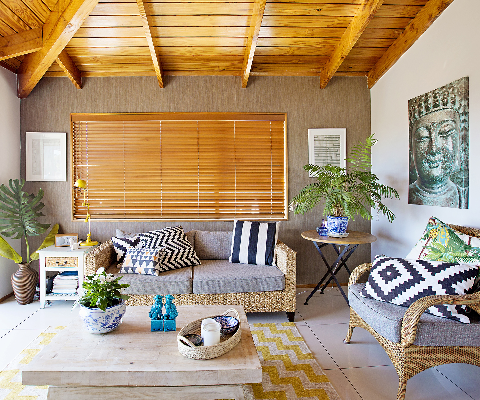 A 1970s-style home is redecorated with tropical-style decor