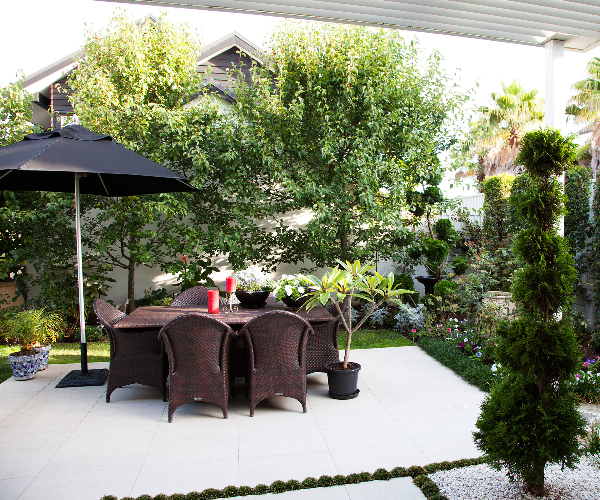 this picture-perfect courtyard garden is small in size but perfectly